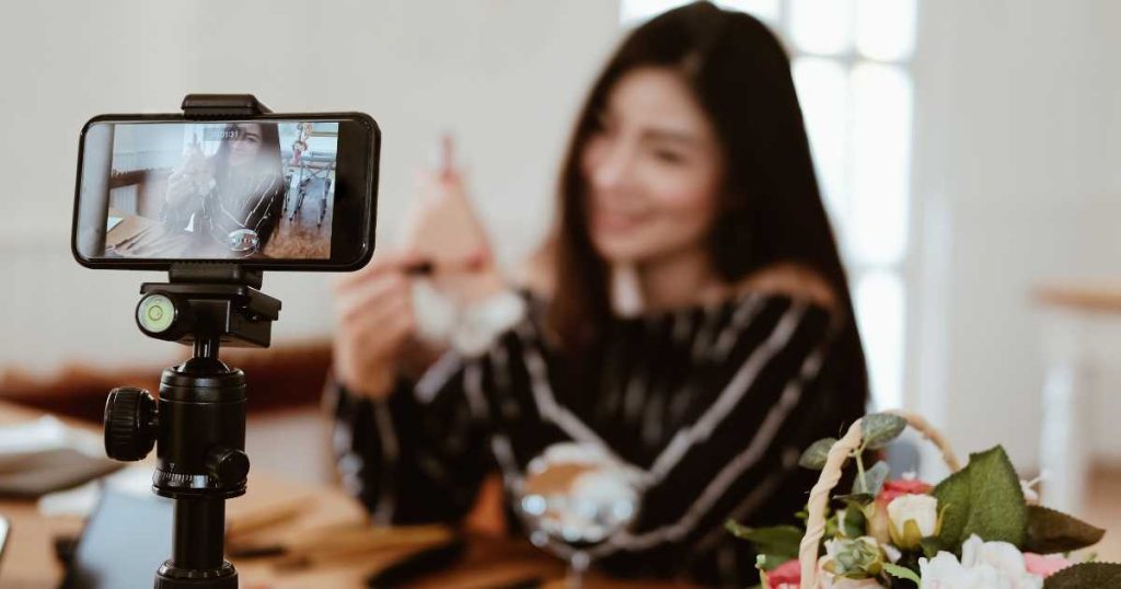 Influencer Marketing | Boost Your Business with Authentic Engagement Influencer Recording a Video with Smartphone for Social Media